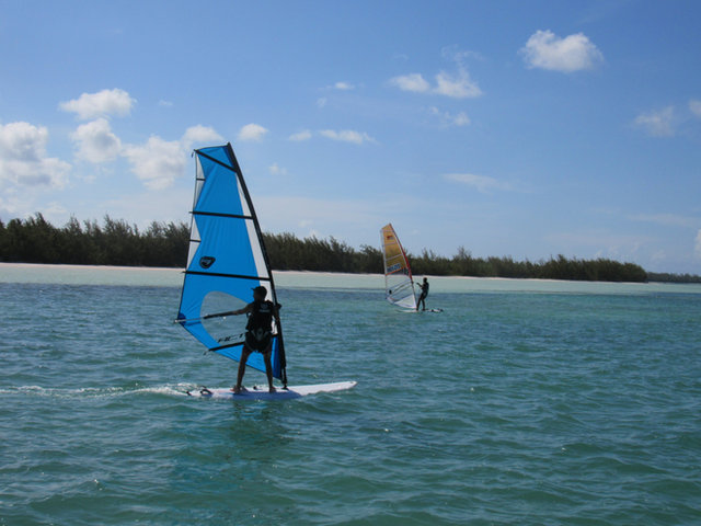 A windsurfer on the turquoise water of Savannah Sound
